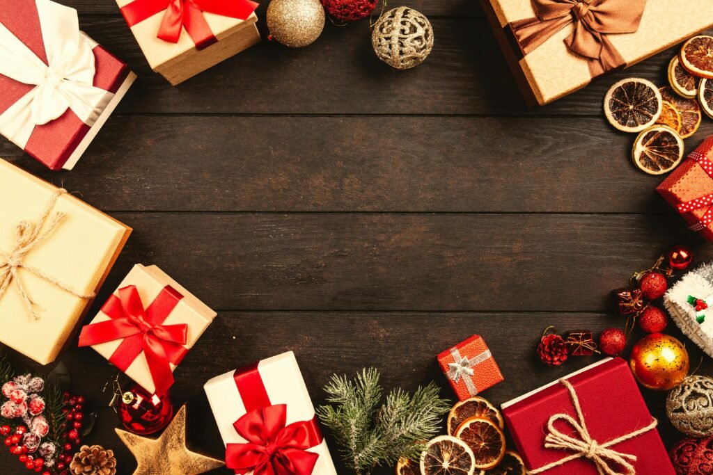 pexels photo 1303088 1303088 Top view of Christmas gifts and decorations on a wooden table, ideal for holiday backgrounds.
